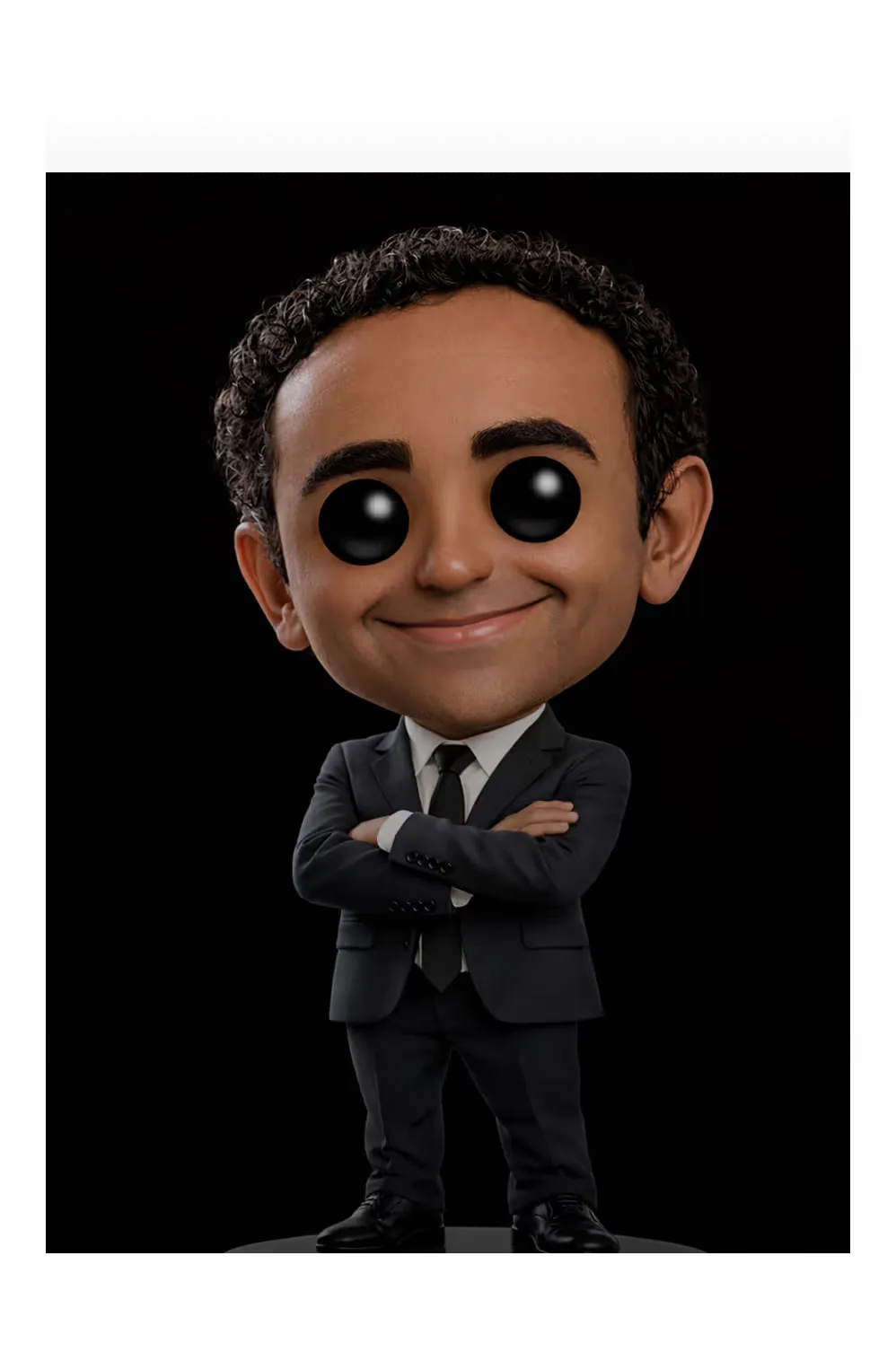 Figurine of Paul: black suit, arms crossed.